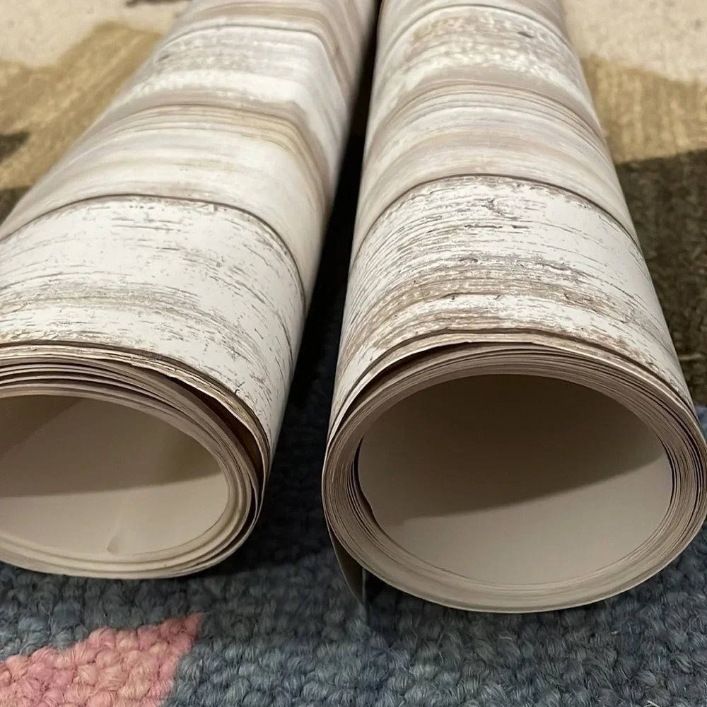 Two rolls of faux wood removable wallpaper